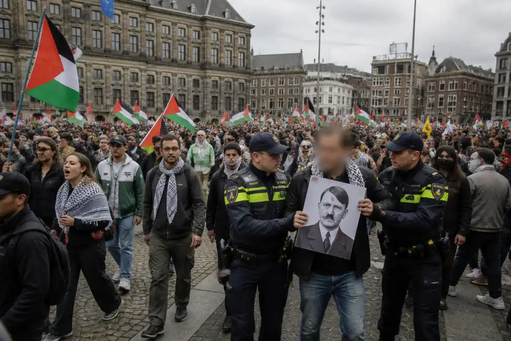 Duizend mensen bij pro-Palestijnse mars op de Dam, man opgepakt om Hitler-spandoek